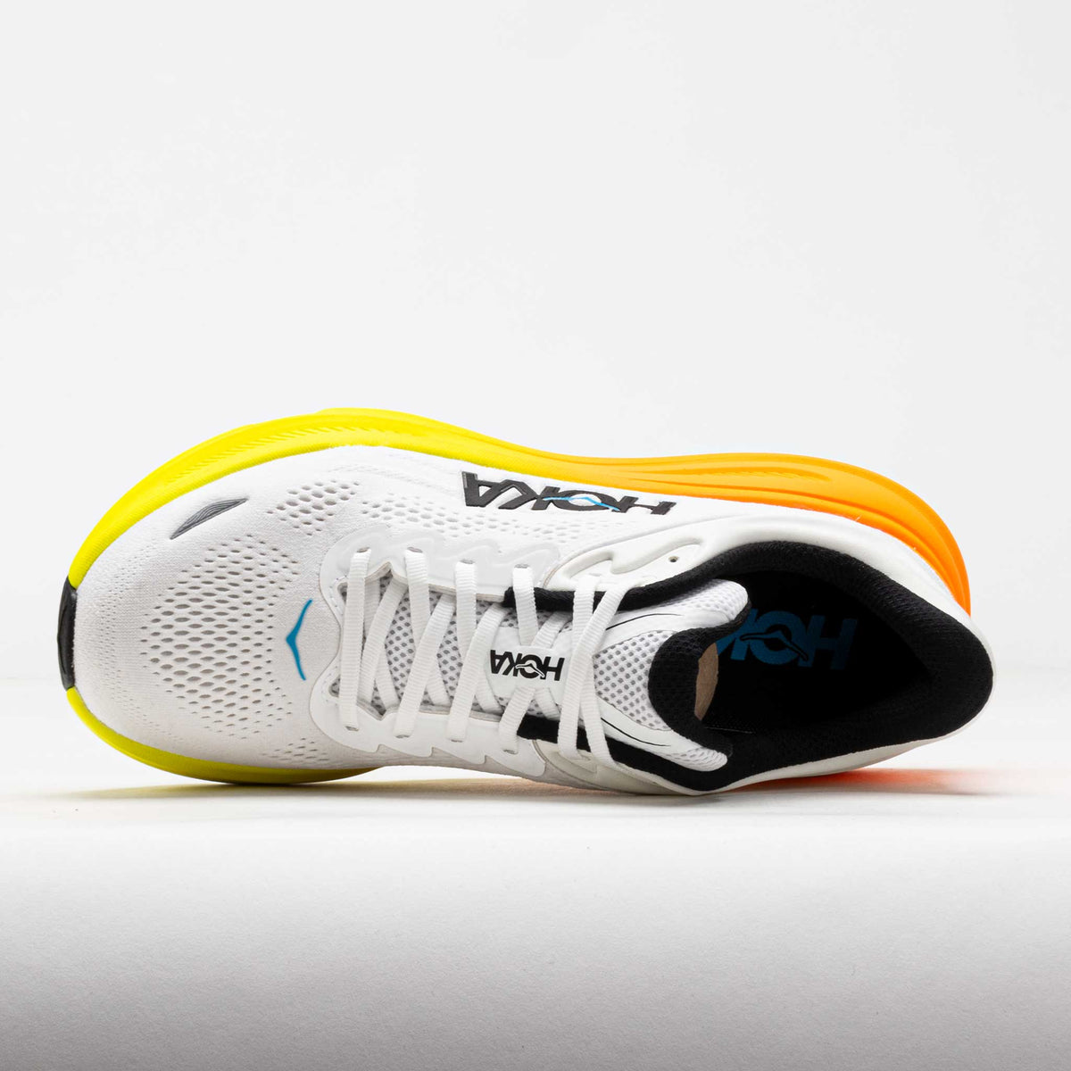 HOKA Bondi 9 running shoe in white with neon tangerine gradient sole, top view