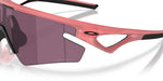 Oakley Sphaera sunglasses with coral pink frame and tinted lenses on white background