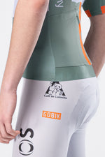 Gobik Ineos Netcompany men's cycling jersey rear view, green and white with orange trim