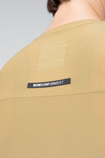 Close-up detail of Gobik Avalon jersey back showing NONCONFORMIST label in Keemun color