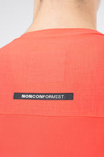 Close-up of Gobik Avalon jersey back showing Nonconformist label and ripstop fabric panel in lava