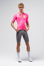 Gobik CX Pro 4.0 cycling jersey in neon pink Drip colorway worn by male model