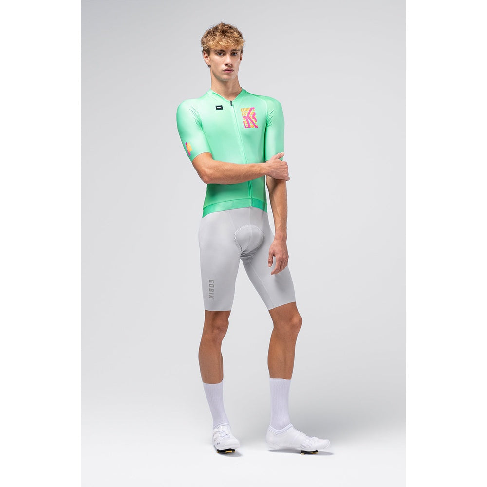 Male cyclist wearing Gobik CX Pro 4.0 mint green jersey with grey bib shorts