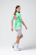 Gobik CX Pro 4.0 cycling jersey in Blast colorway worn by female model, rear view