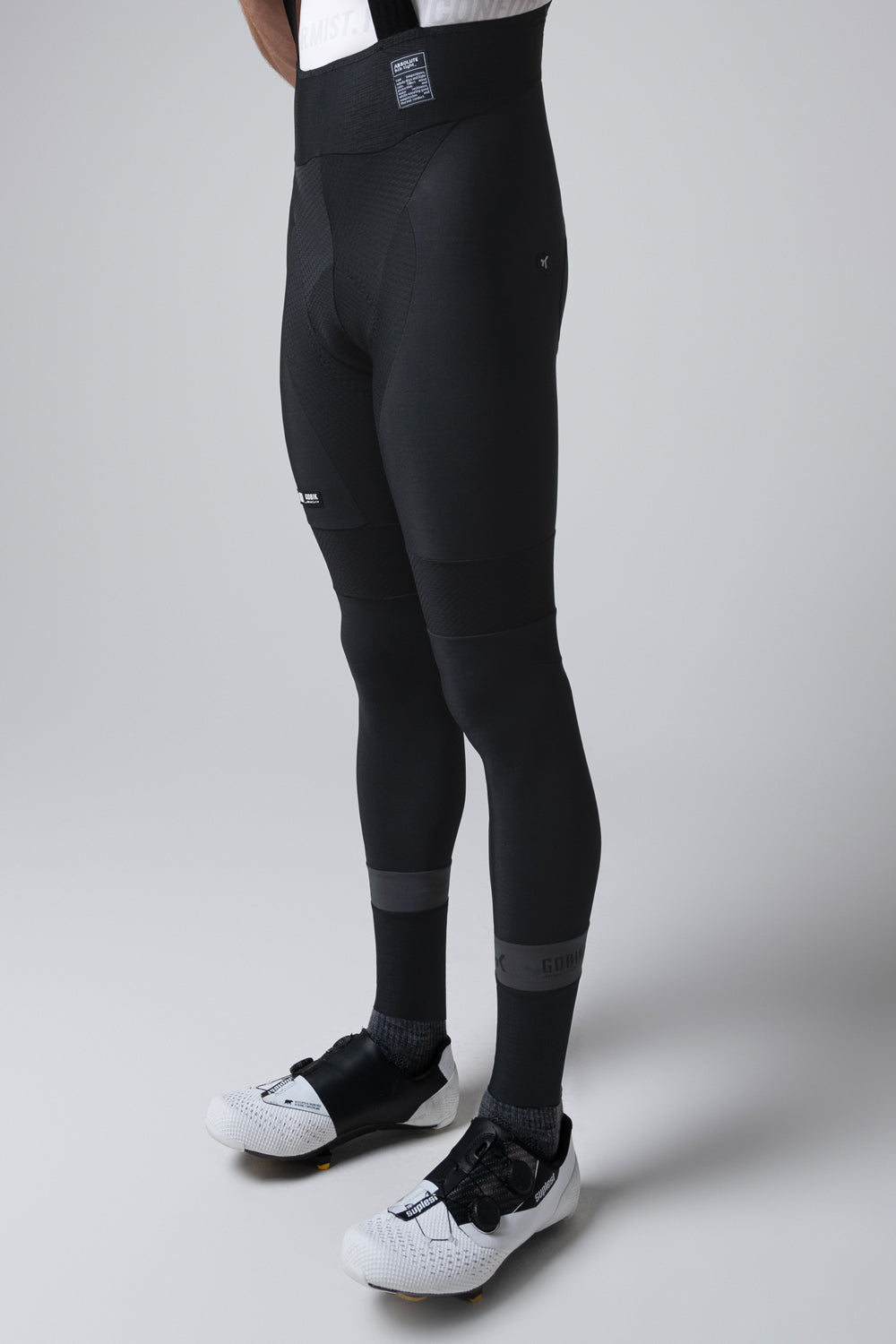 Professional product photo of black Gobik Absolute 7.0 bib shorts on model