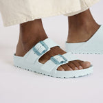 Birkenstock Arizona EVA sandals in Surf Green with double buckle straps on model