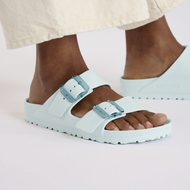 Birkenstock Arizona EVA sandals in Surf Green with double buckle straps on model