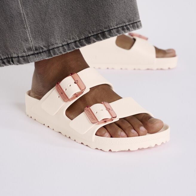 Birkenstock Arizona EVA sandals in light rose with double buckle straps on model