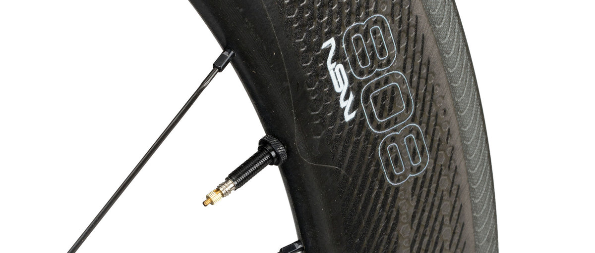 Zipp 808 NSW Carbon Tubeless Disc Wheel close-up showing valve stem and carbon rim detail