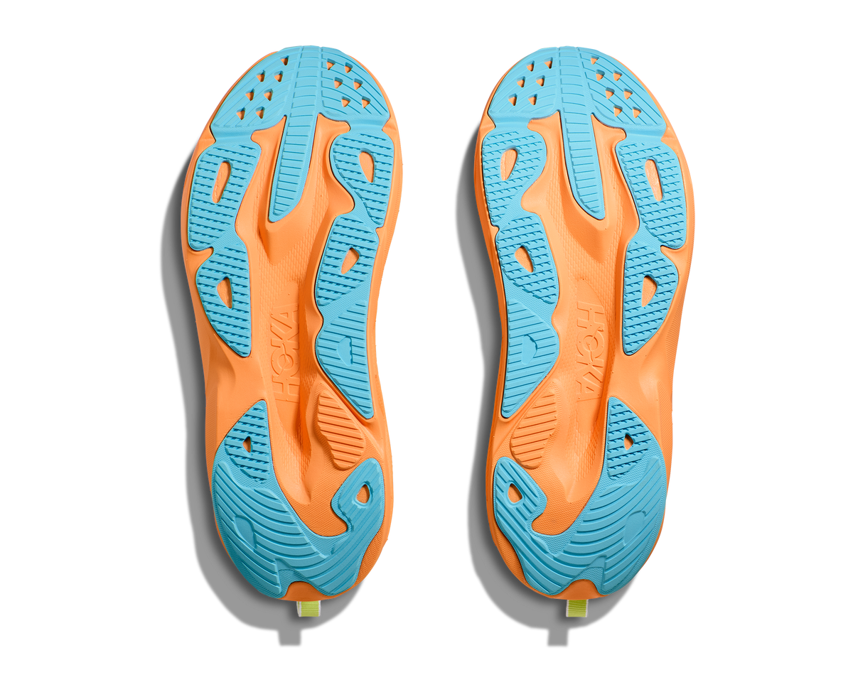 Hoka Skyflow running shoes bottom sole view showing orange and blue rubber outsole pattern