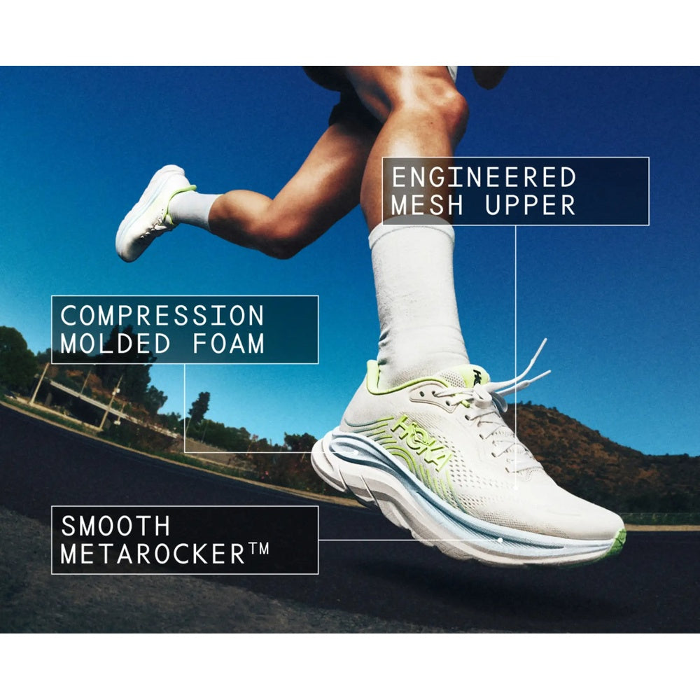 HOKA Clifton 11 running shoe in white with green accents shown mid-stride outdoors