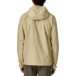 Patagonia Men's Torrentshell 3L Jacket in Weathered Stone worn by male model, rear view