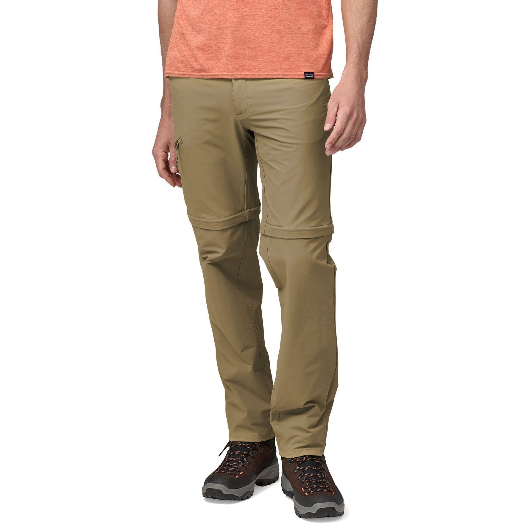 Man wearing Patagonia Quandary convertible pants in tan with hiking boots