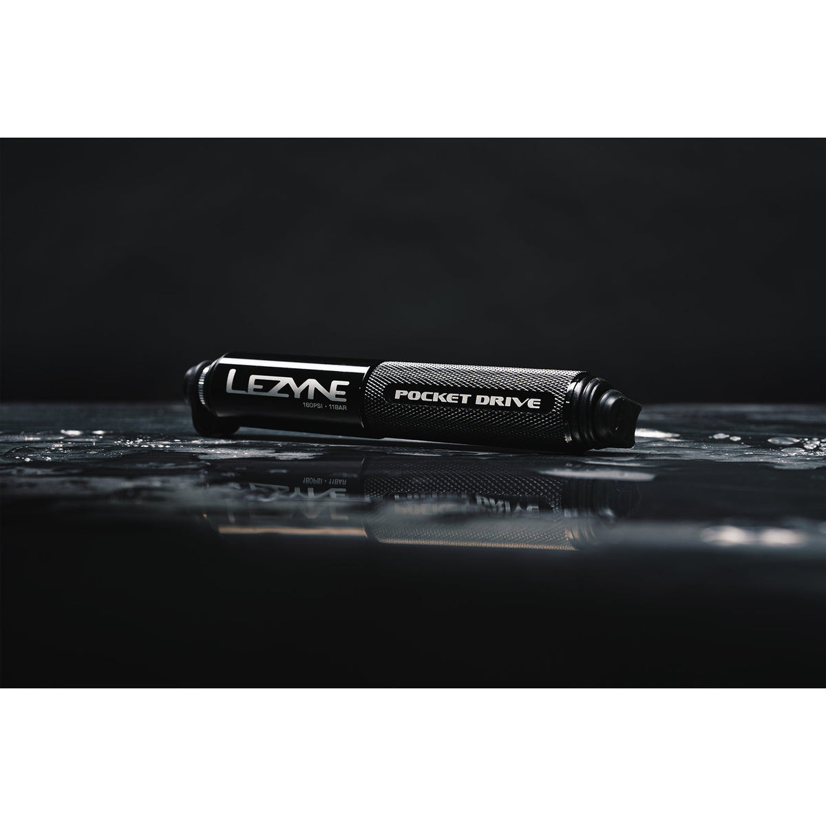 Lezyne Pocket Drive mini pump in matte black on reflective wet surface