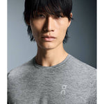 Asian male model wearing heather grey On Core Long-T shirt in professional studio portrait