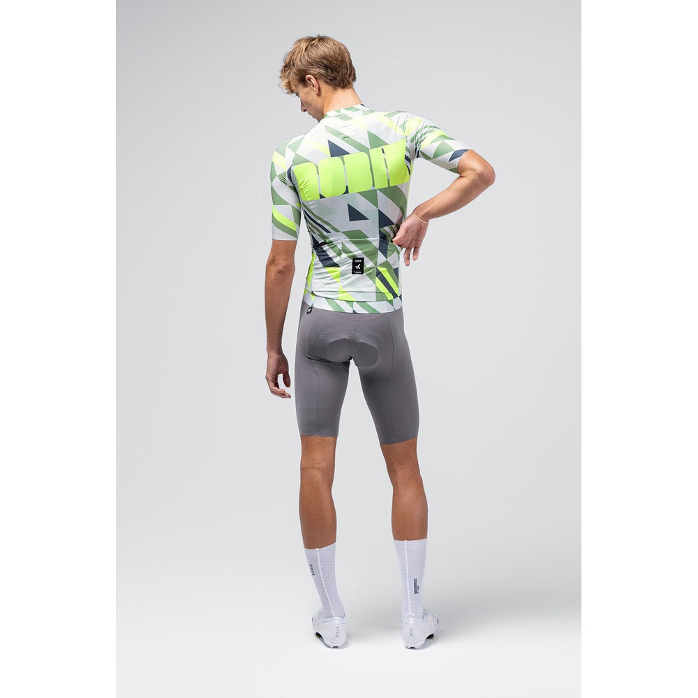 Back view of male model wearing Gobik CX Pro cycling jersey with geometric triangle pattern