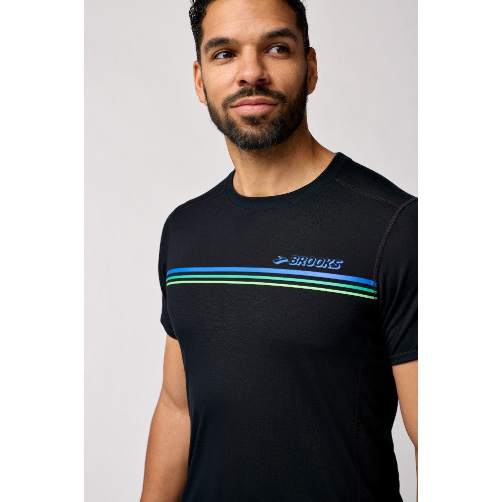 Man wearing Brooks Distance Short Sleeve 3.0 black shirt with gradient stripe detail