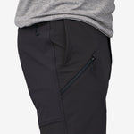 Close-up of black Patagonia Point Peak Trail Pants showing side zipper pocket detail