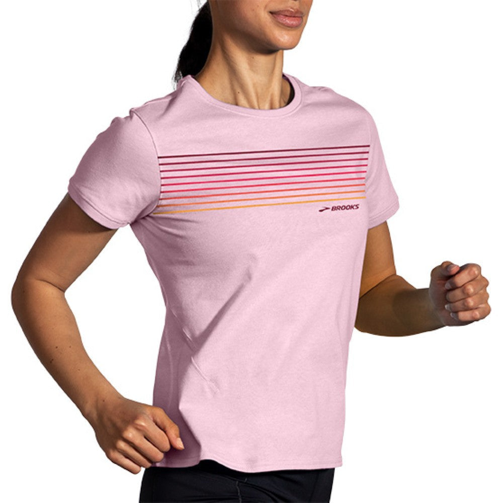 Woman wearing Brooks Distance Short Sleeve running shirt in quartz with gradient stripe design