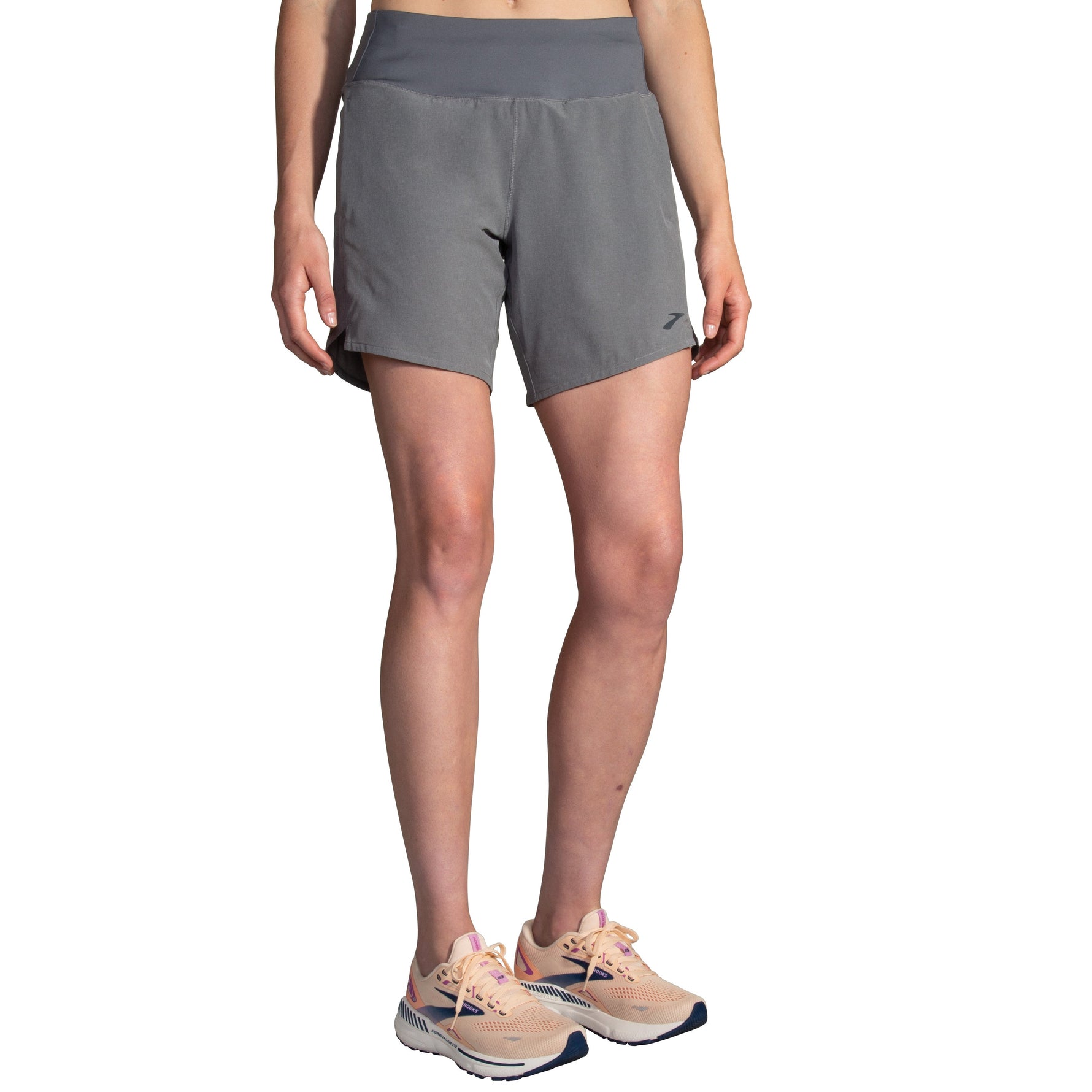 Brooks Chaser 7-inch women's running shorts in heather charcoal gray with sneakers