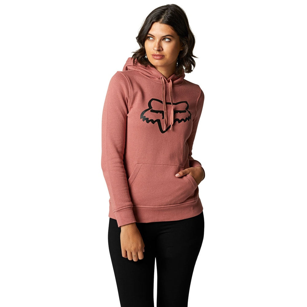 Woman wearing Fox Racing rose pink pullover hoodie with black Fox logo