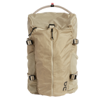 On Speed Pack 18L Lite backpack in cream sand color with rope handle and compression straps