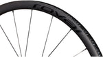Specialized Roval carbon wheel rim with black spokes on white background