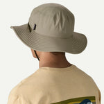 Person wearing Patagonia Brimmer Hat in sage green from behind showing wide brim
