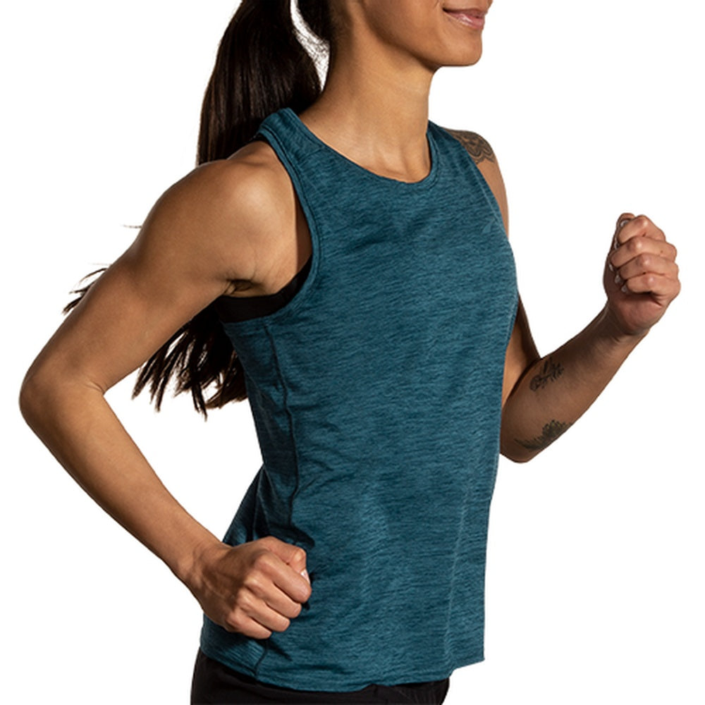 Woman running in Brooks Luxe Tank in heathered ocean drive teal color