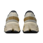 On Cloudmonster 2 running shoes in cream and mustard colorway, rear view