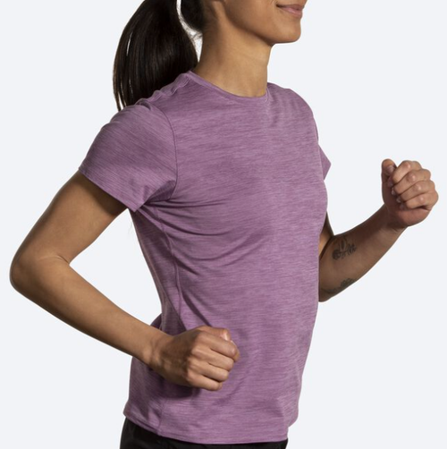Woman wearing Brooks Luxe short sleeve running shirt in heathered washed plum