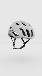 KASK Mojito Cubed helmet in white matte finish with ventilation holes and black chin strap