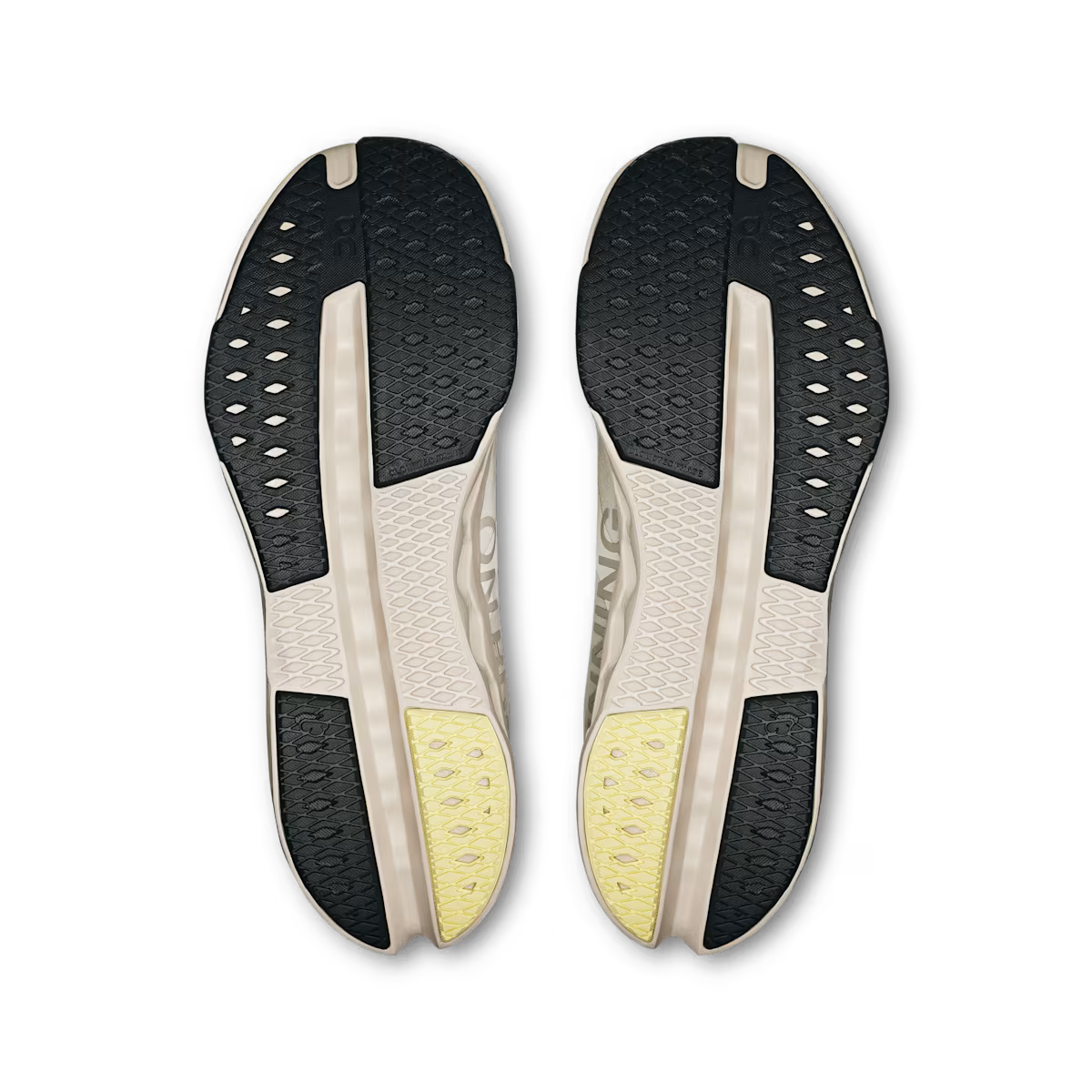 On Cloudsurfer Next men's running shoes outsole view showing black rubber traction pattern and yellow heel