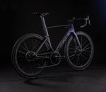 X-LAB AD9 carbon road bike in purple-black colorway photographed from rear three-quarter angle