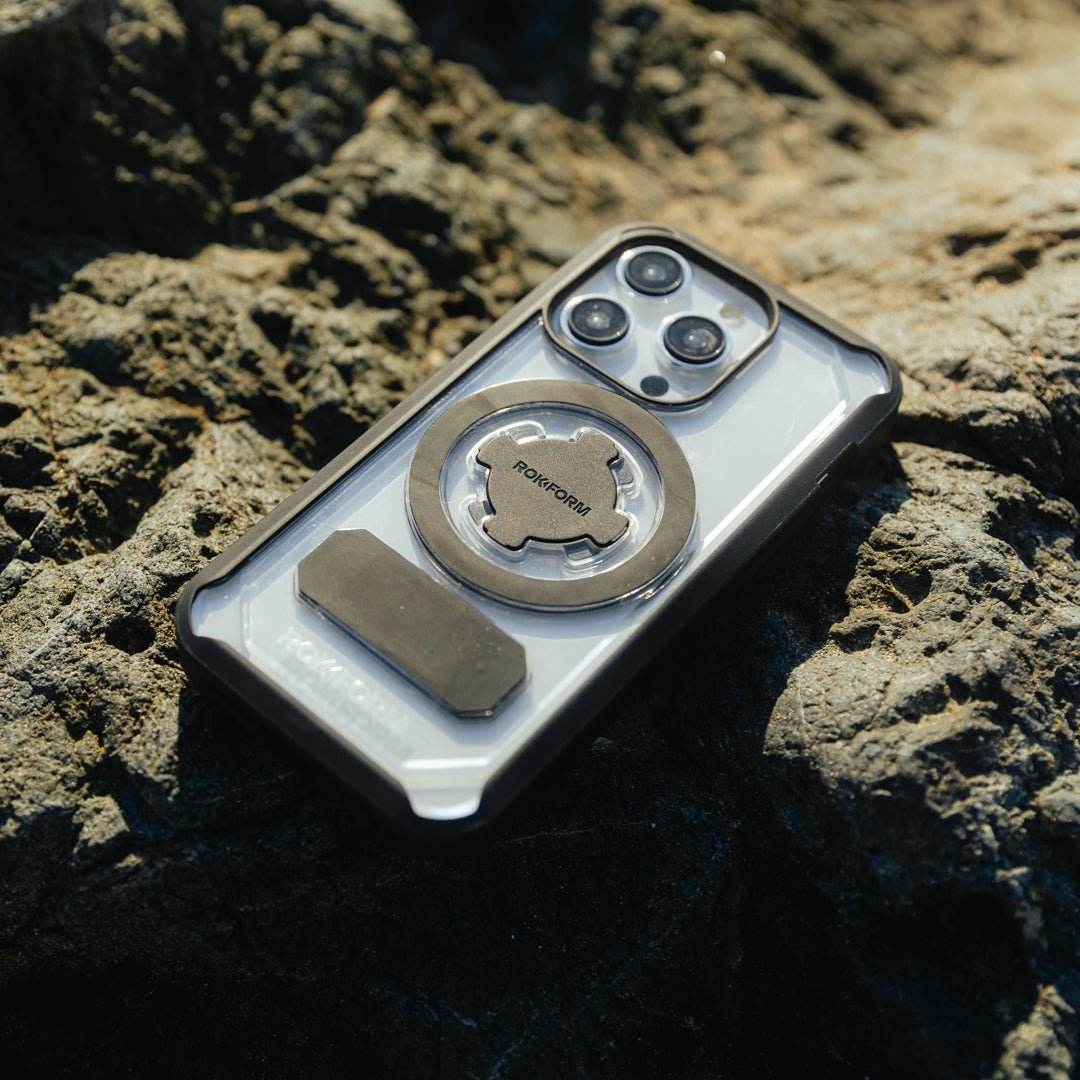 Rokform Crystal Case for iPhone 15 Pro Max with magnetic mount on rocky surface