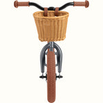 Retrospec Baby Beaumont 12-inch balance bike in graphite matte with wicker basket, front view