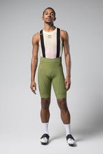 Man wearing Gobik Matt 2.0 olive green cycling bib shorts with mesh base layer