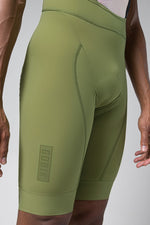 Gobik Matt Men's Bibshort in timber green with professional studio photography