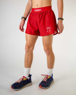 ChicknLegs 2-inch DS Split Shorts in Cardinal Red worn by male runner with running shoes