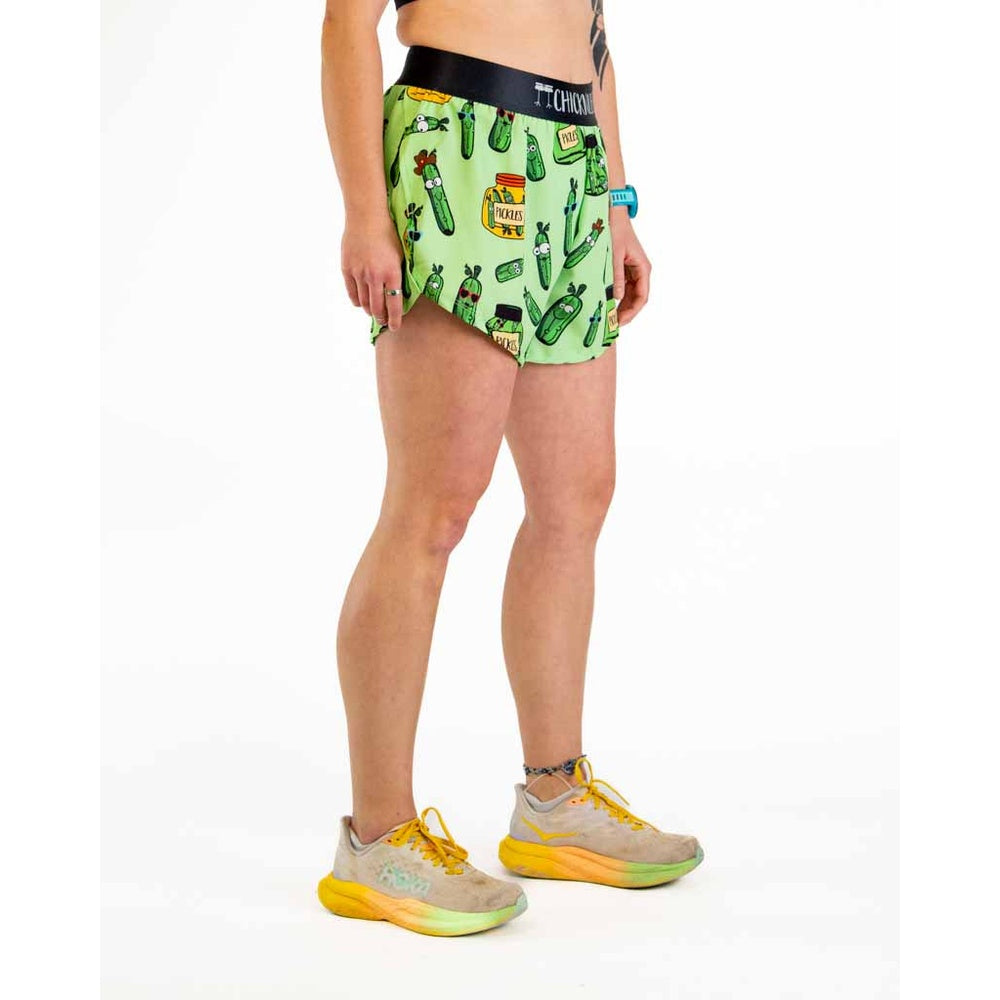 Woman wearing green ChicknLegs running shorts with colorful pickle print pattern