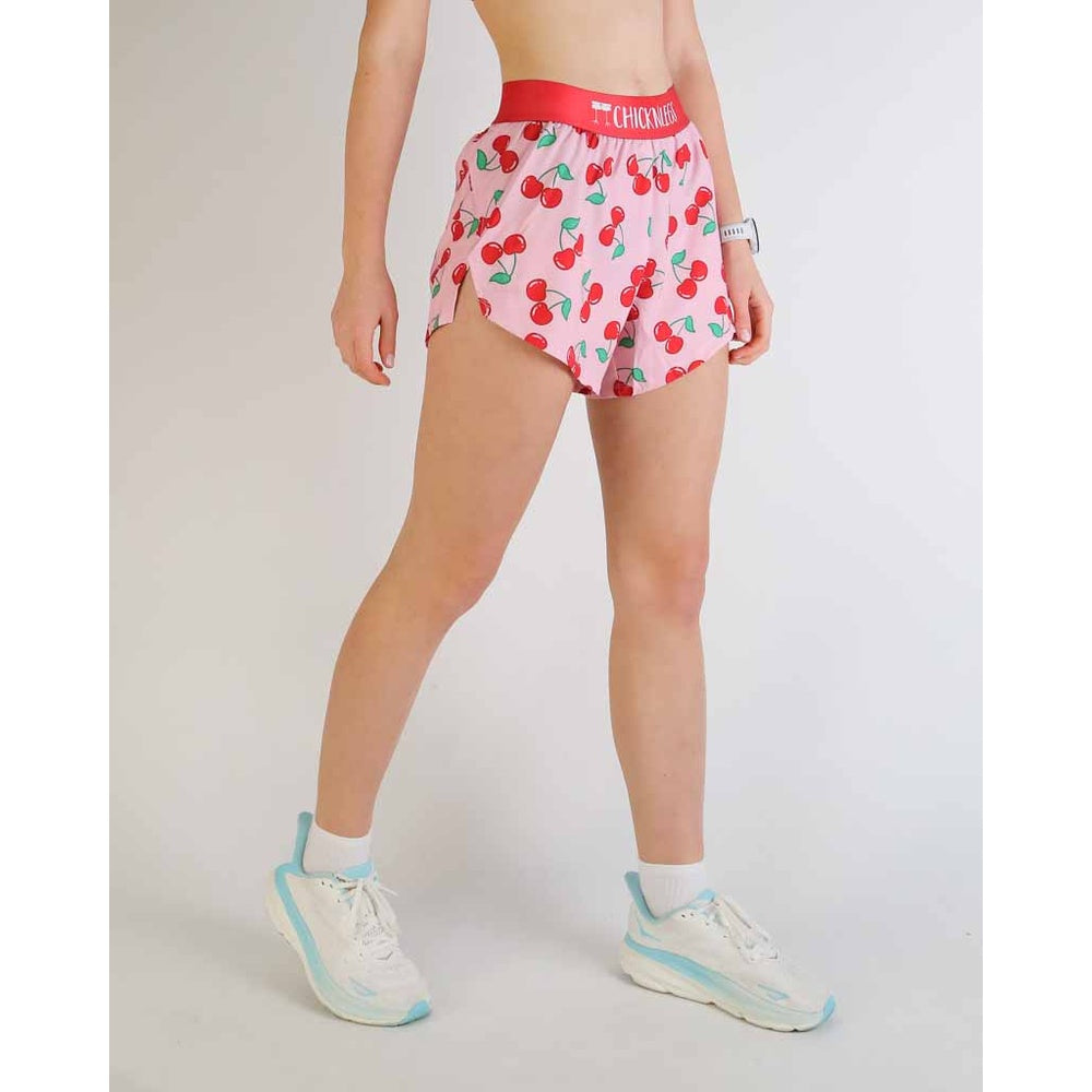 ChicknLegs 4-inch split running shorts in pink cherry print with red waistband