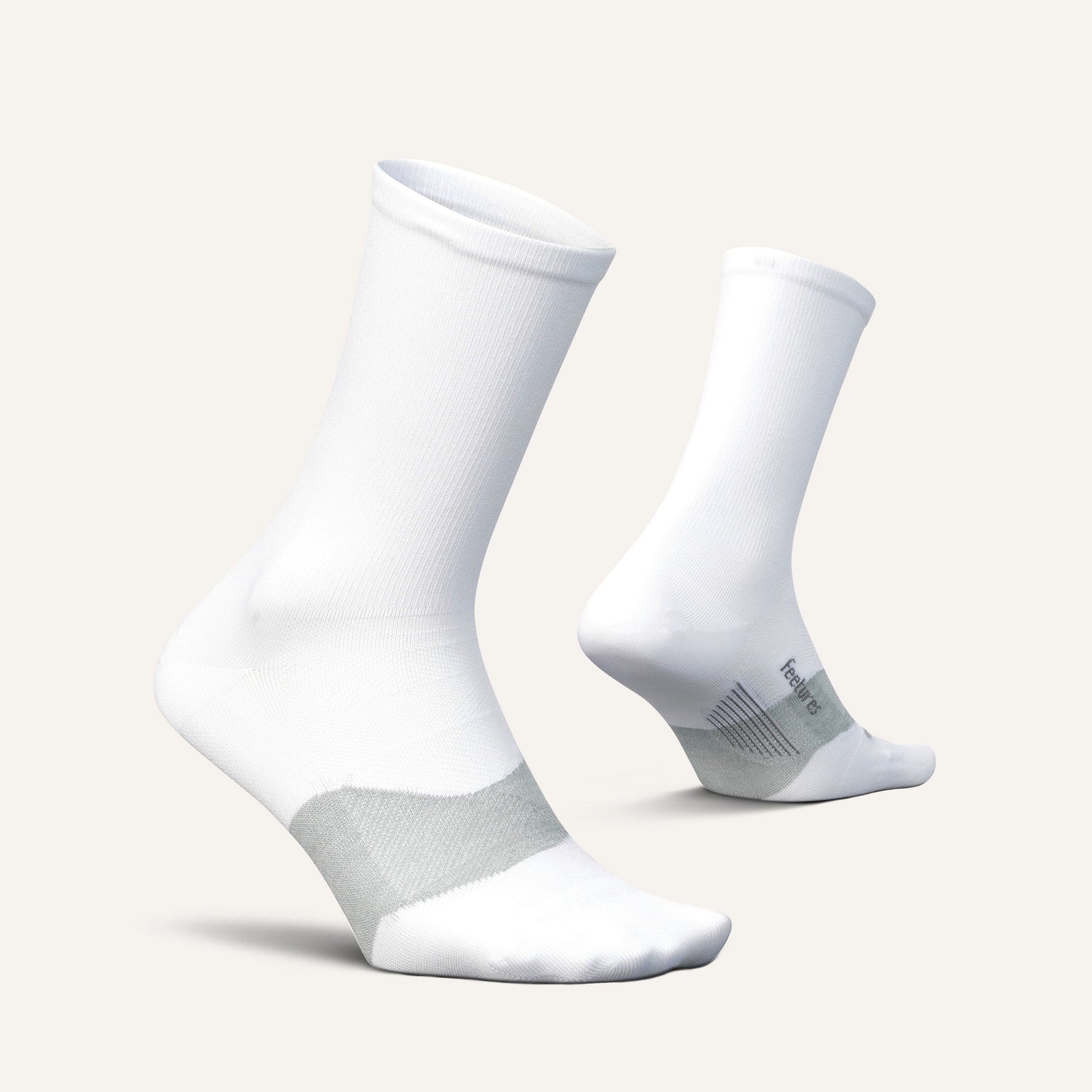Feetures Elite Ultra Light Mini Crew socks in white shown from front and back angles