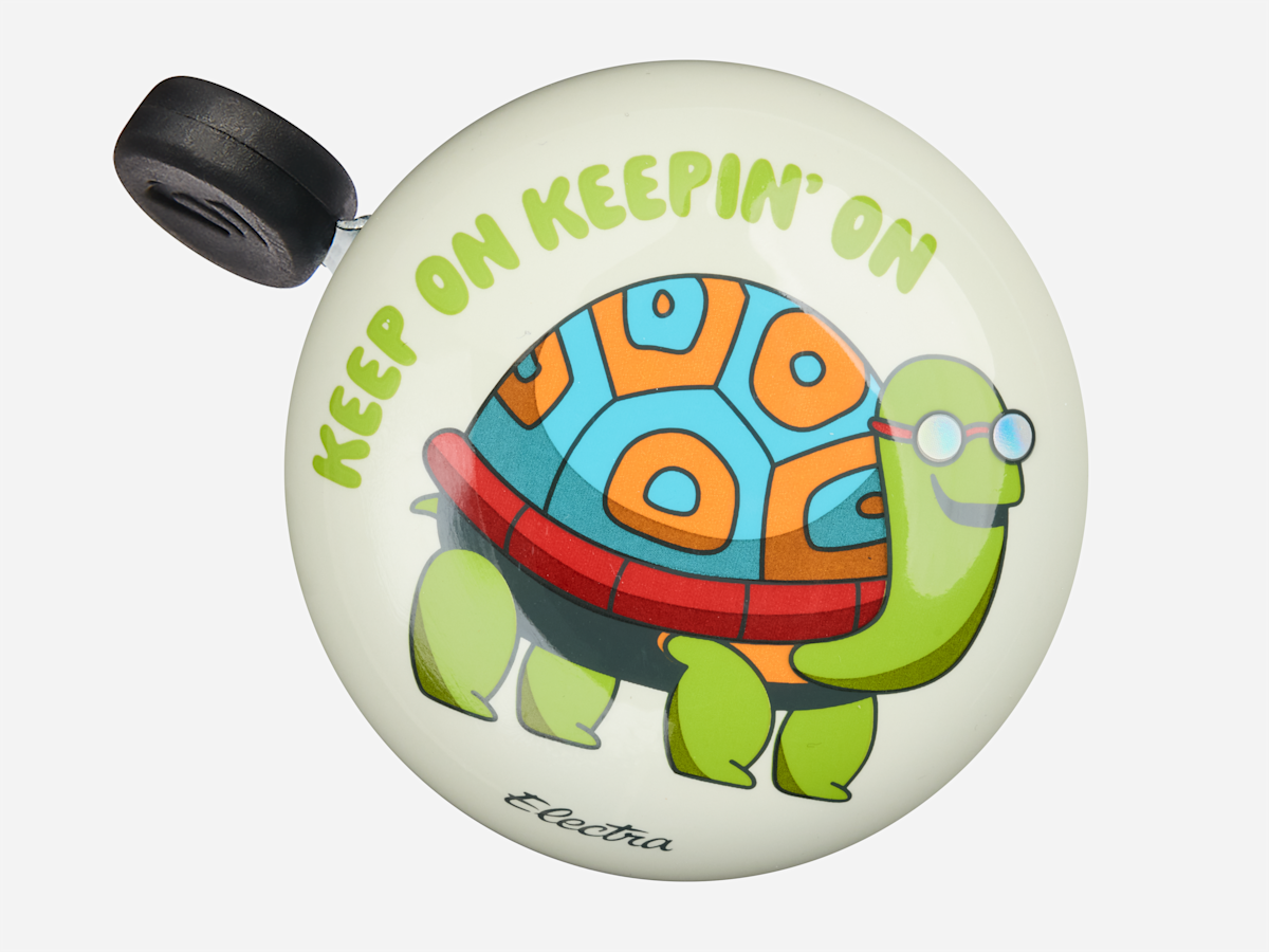 Electra Ringer Bike Bell in Slow Ride design featuring cartoon turtle on white dome