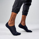 Feetures Elite Light Cushion Invisible black no-show socks worn by male model