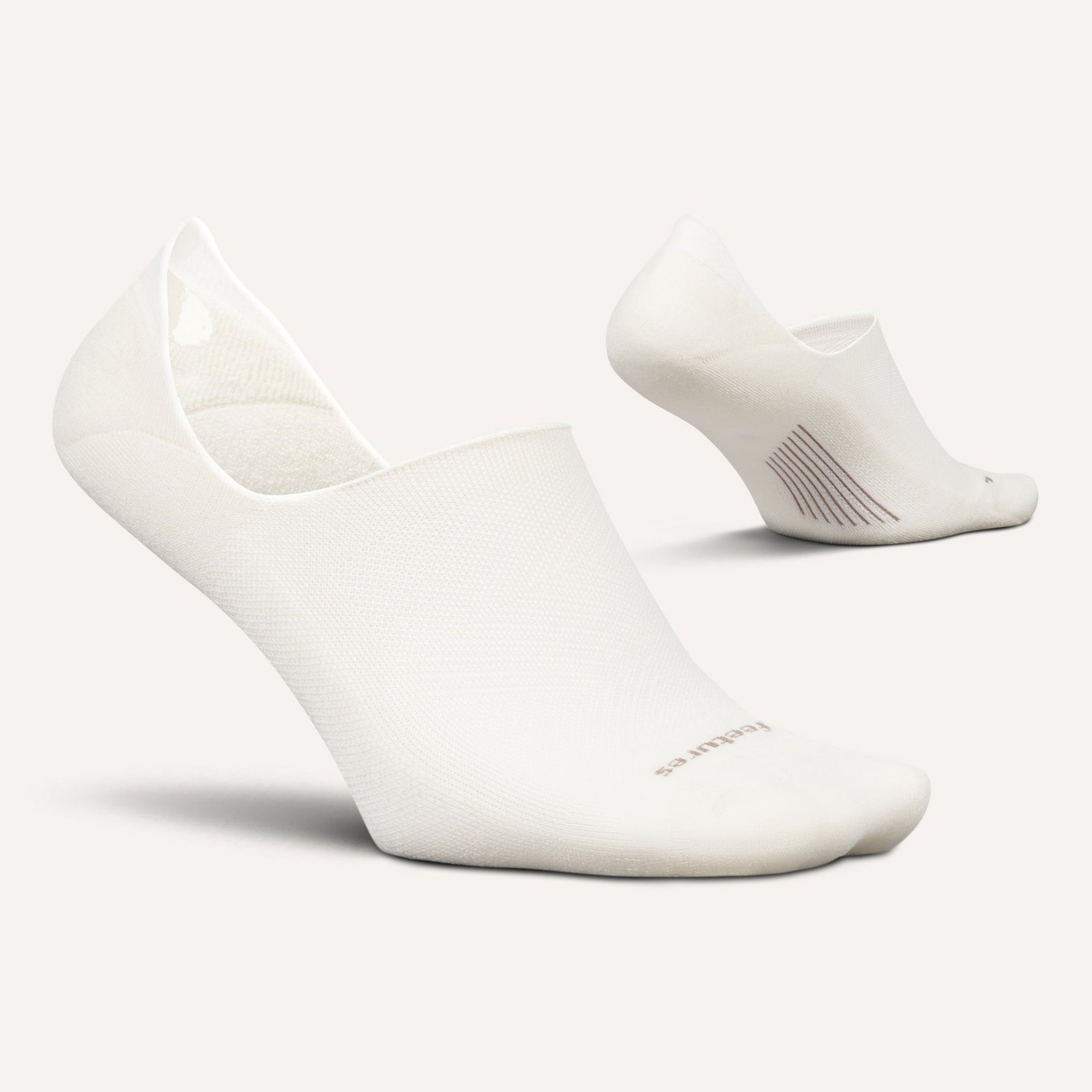 Feetures Elite Light Cushion Invisible no-show socks in white Ice color, pair shown