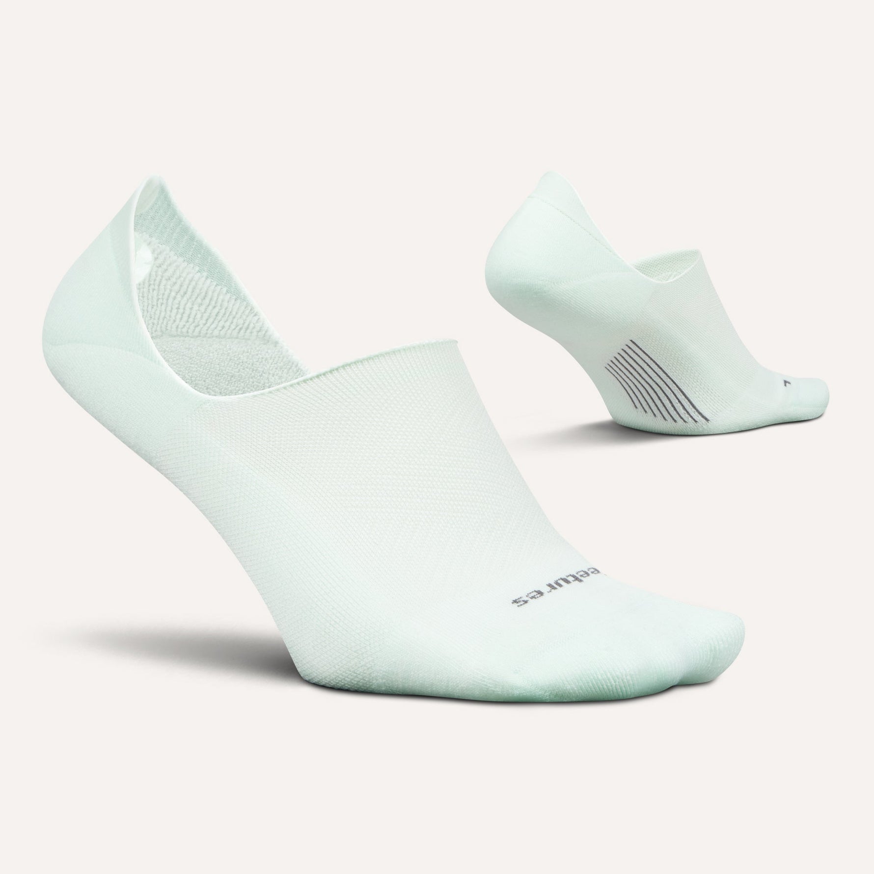 Feetures Elite Light Cushion Invisible no-show socks in mint green, pair shown