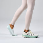 Feetures Elite Light Cushion Invisible sock in mint worn with New Balance sneakers