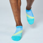 Feetures Elite Light Cushion Tab socks in Mint Chip colorway worn by running model