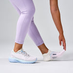 Feetures Elite Light Cushion Tab socks in White Rose worn with light blue running shoes