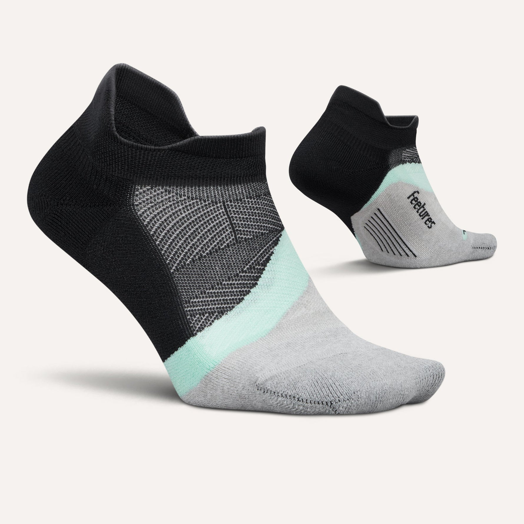 Feetures Elite Light Cushion No Show Tab socks in black, gray, and mint colorway
